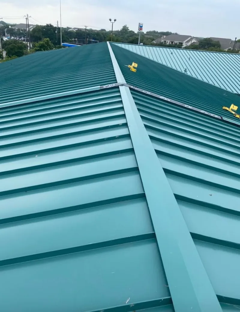 Green commercial metal roof ridge and valley for Metal Roof Repair in Blackman