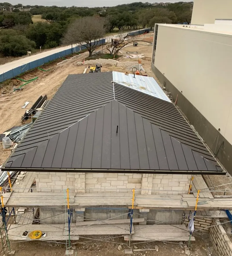 Metal roof new construction with scaffolding in Blackman